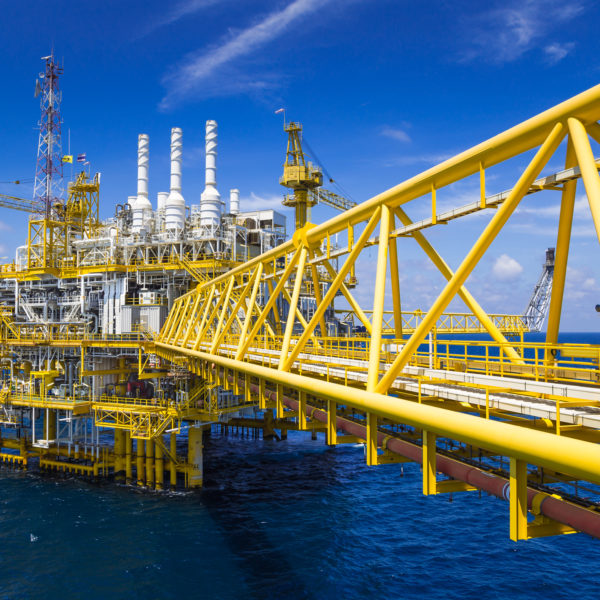 Oil and Gas production platform in blue sky located at the gulf of Thailand.